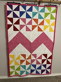 Pink pinwheel and chevron quilt